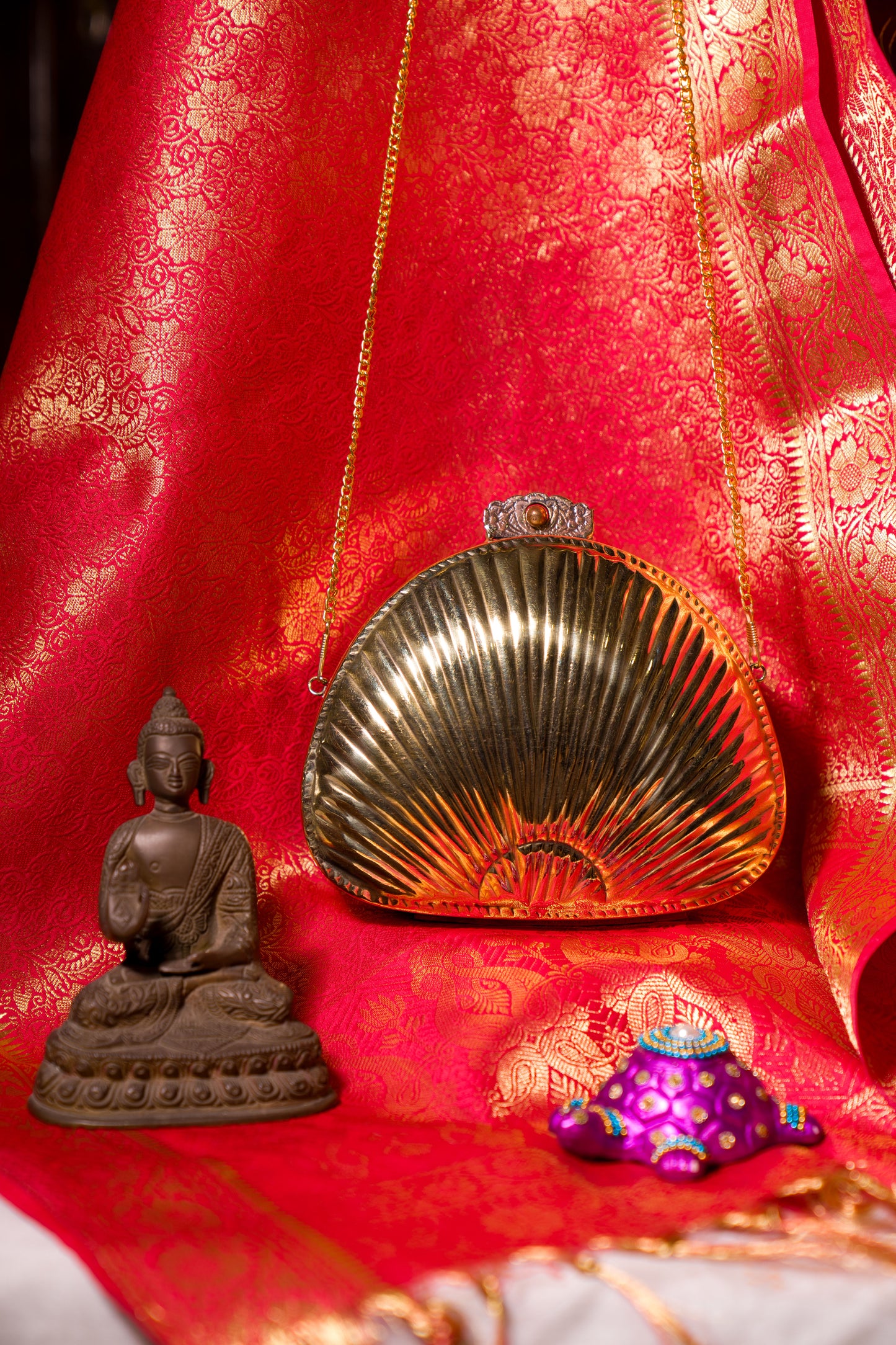 Ethnic brass bag in shell shape