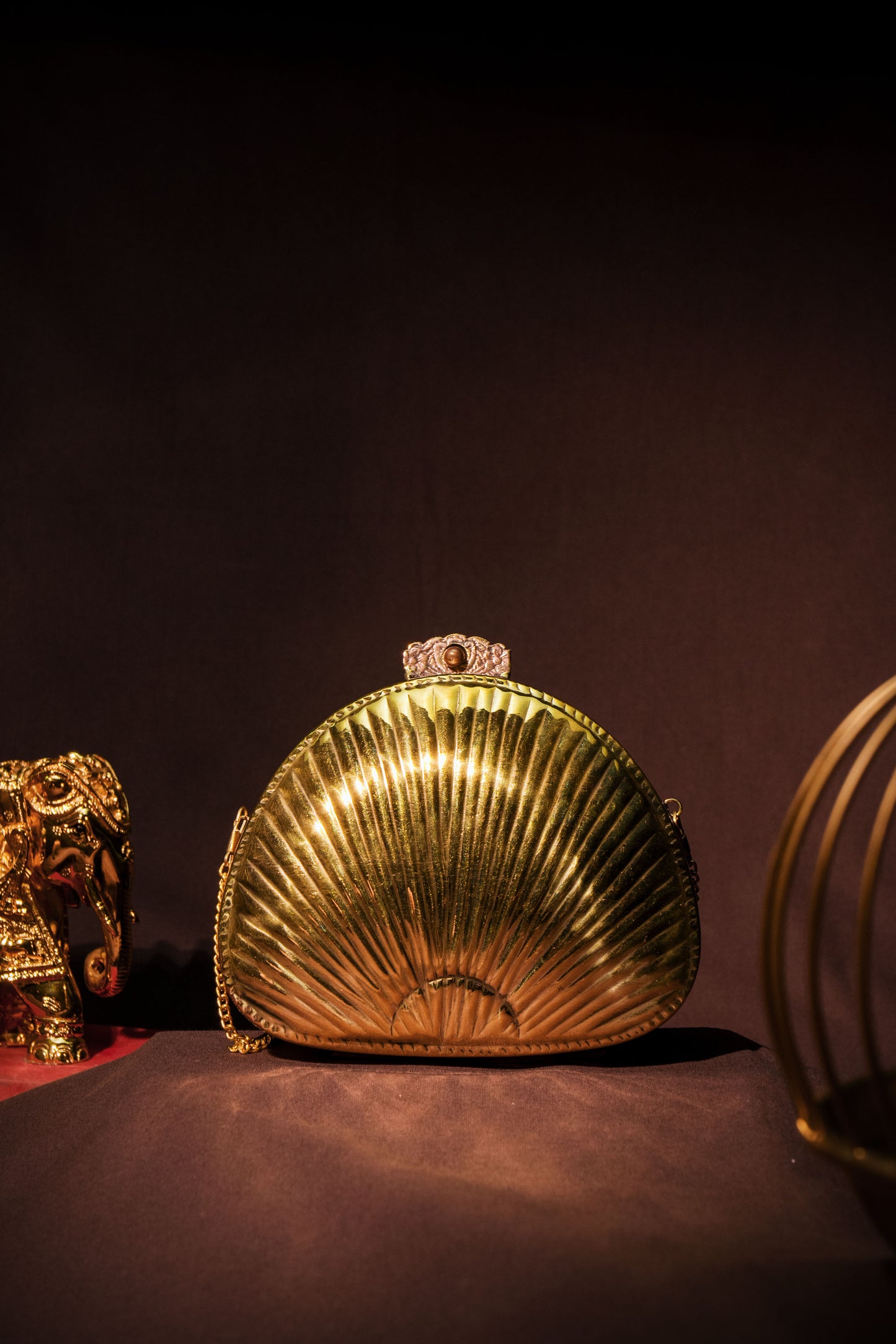 Ethnic brass bag in shell shape