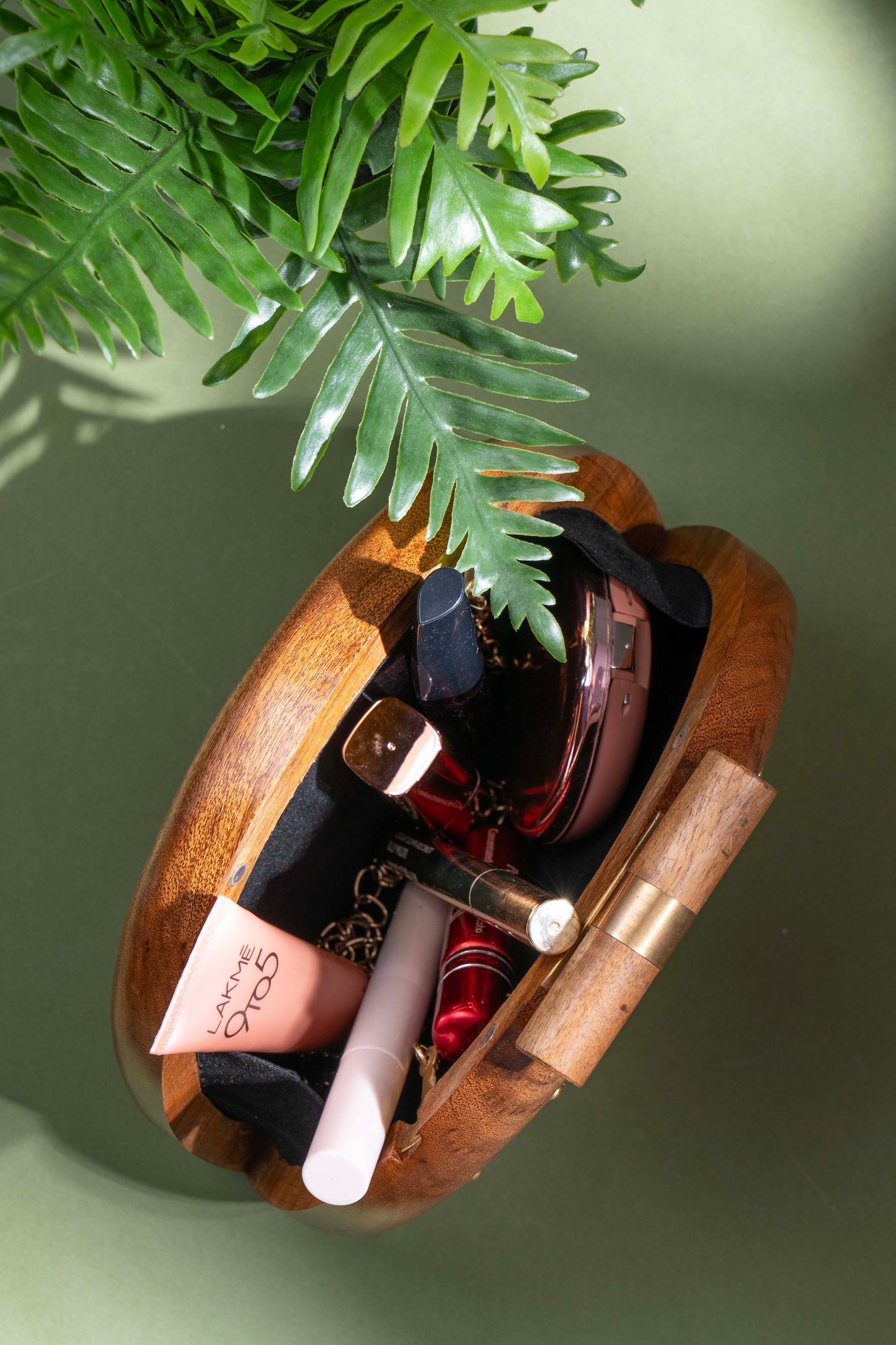 The Royals Hand Carved capsule bag in Acacia wood