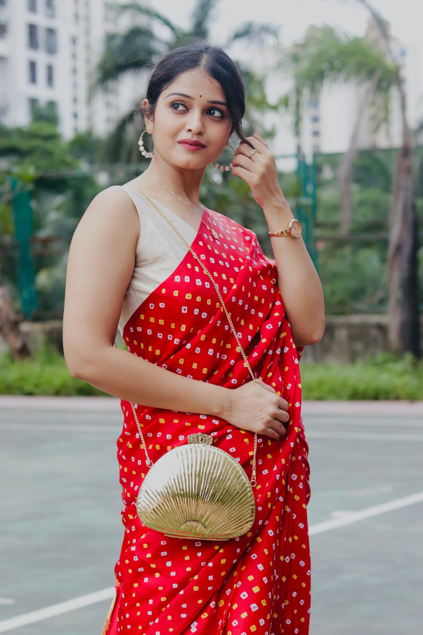 Ethnic brass bag in shell shape