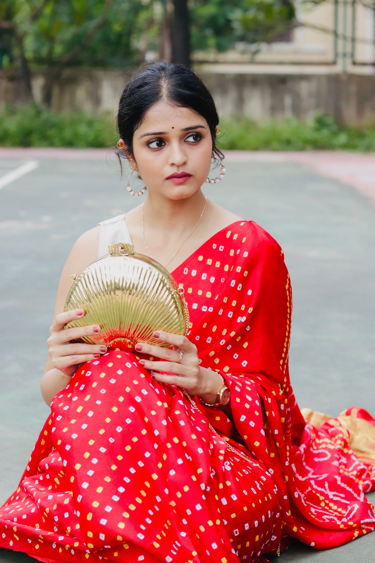 Ethnic brass bag in shell shape