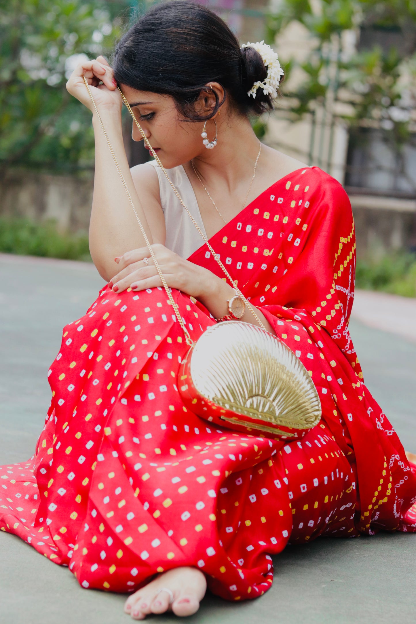 Ethnic brass bag in shell shape