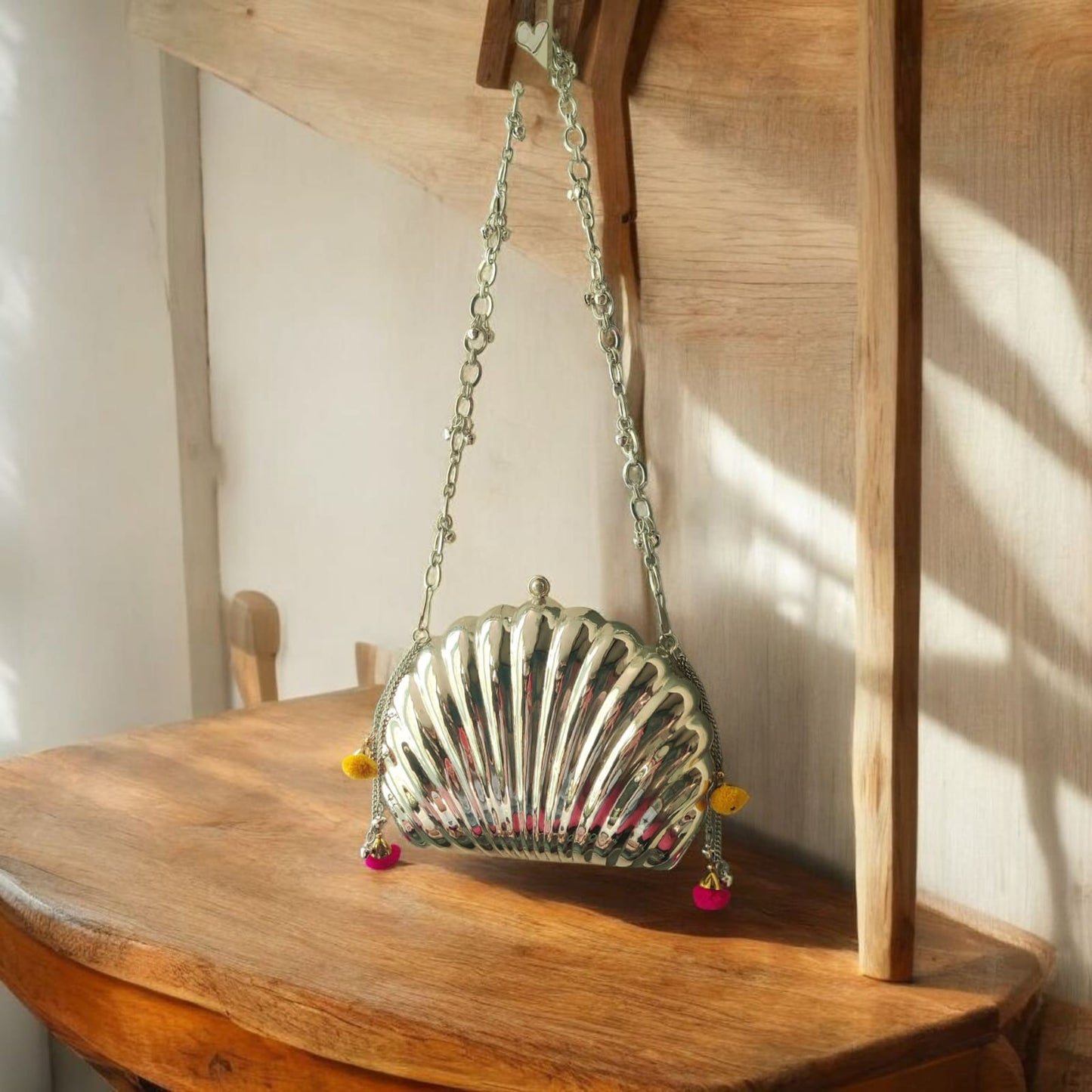 Aafreen Shell Ghungroo Brass Bag in silver finish
