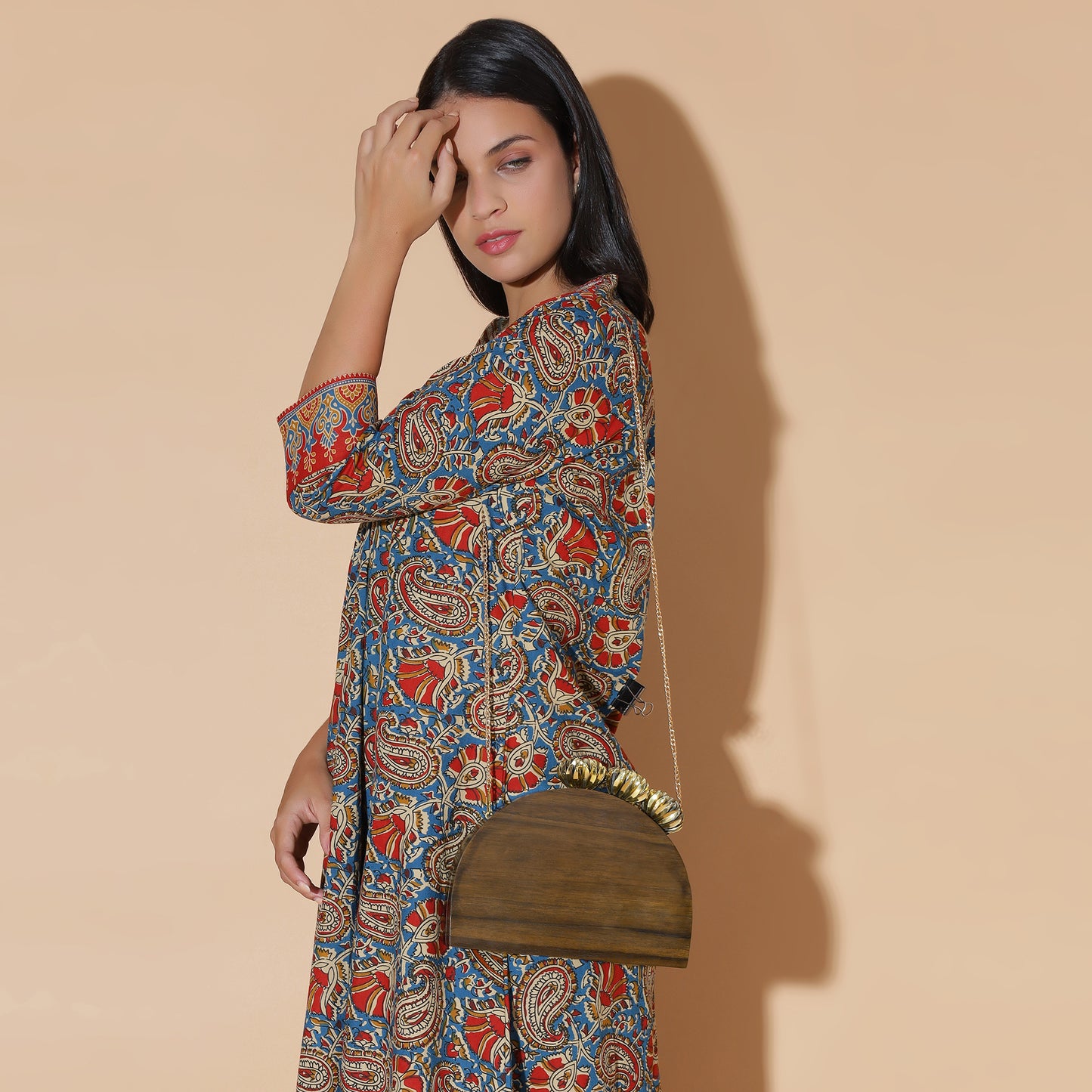 The Royal Semi Circle Bag with ornate brass floral