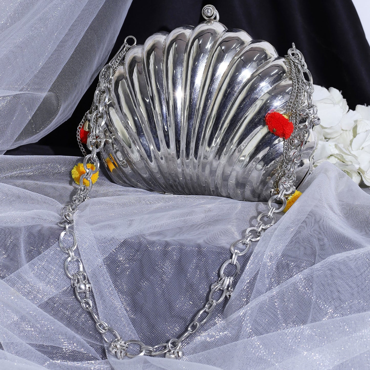 Aafreen Shell Ghungroo Brass Bag in silver finish