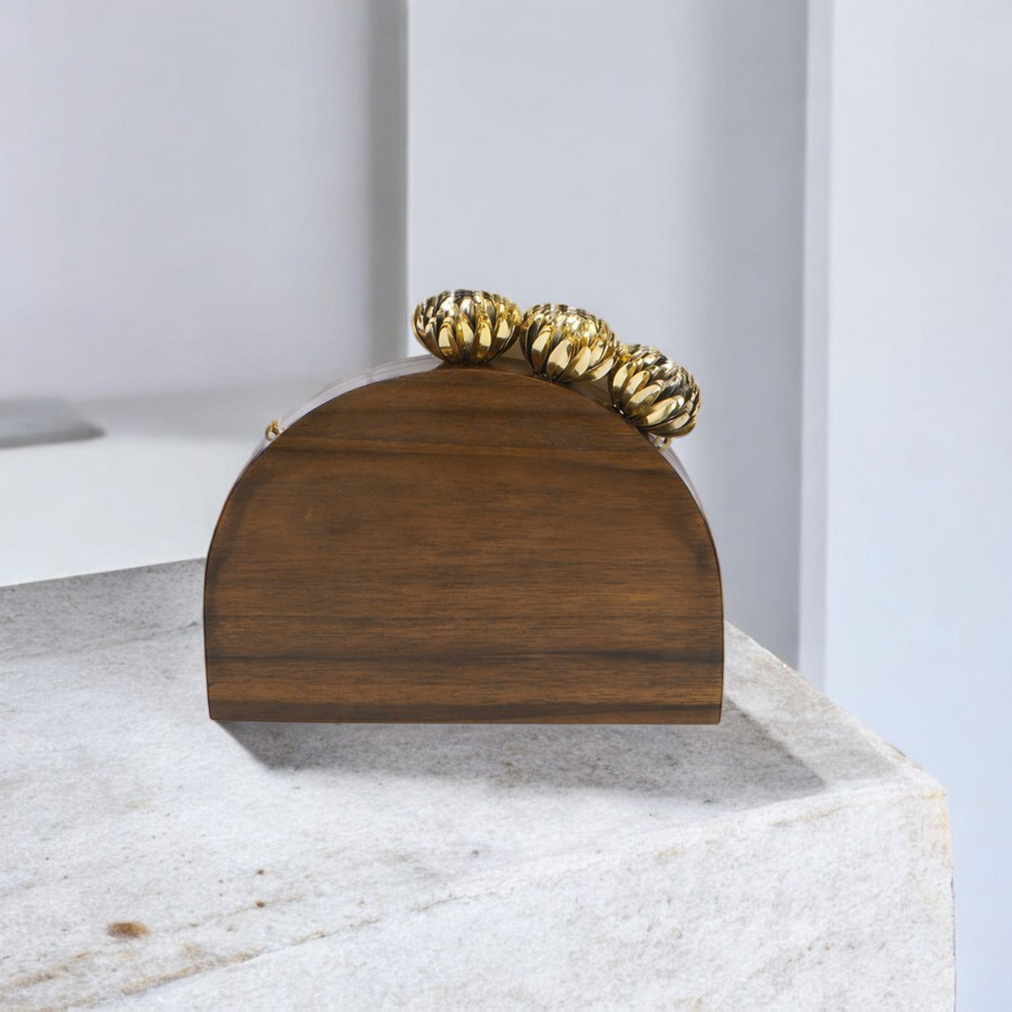 The Royal Semi Circle Bag with ornate brass floral