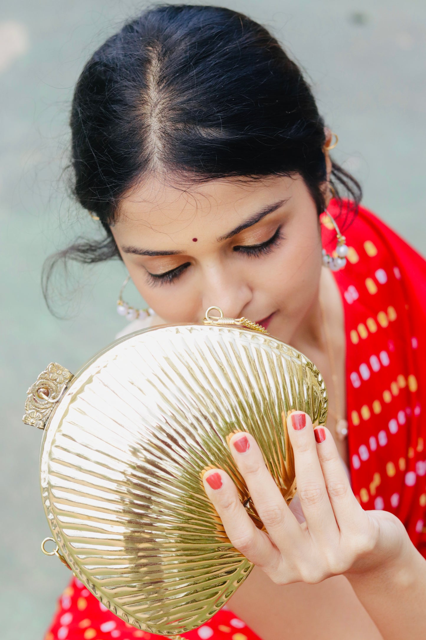 Aafreen Ethnic brass bag in shell shape