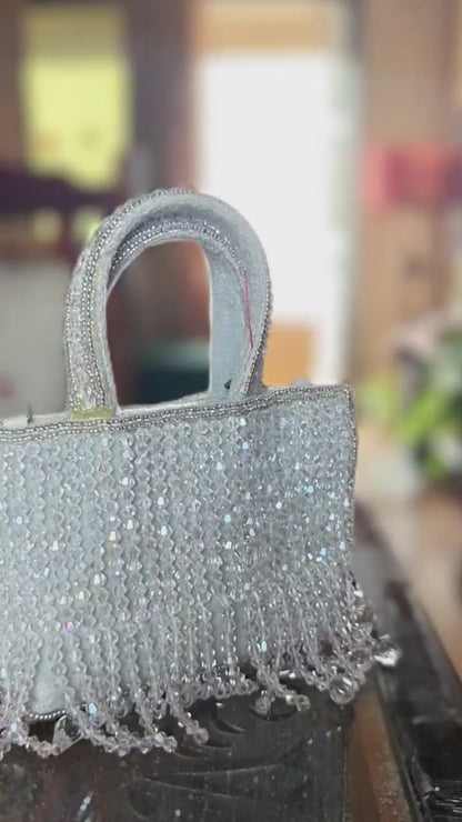 The Mini Potli Embroidered bag with crystal fringes