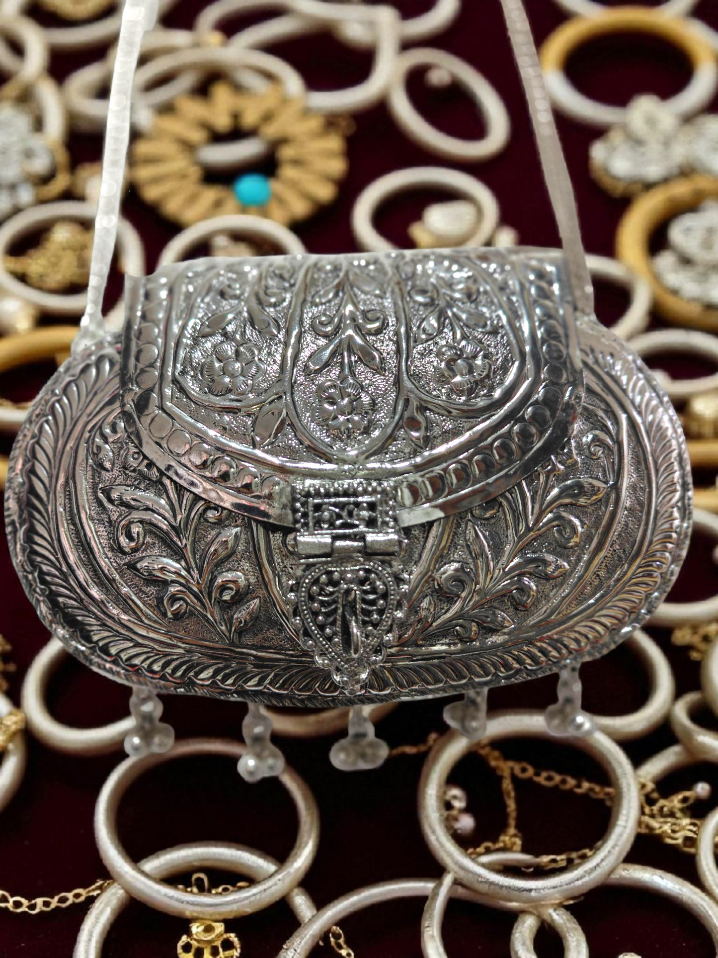 Oval Ethnic Handbag in Silver shade, tassels and ornate ghungroo sling chain