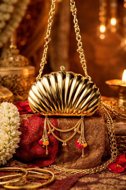 The Shell Heritage Brass Ghungroo bag in gold tone