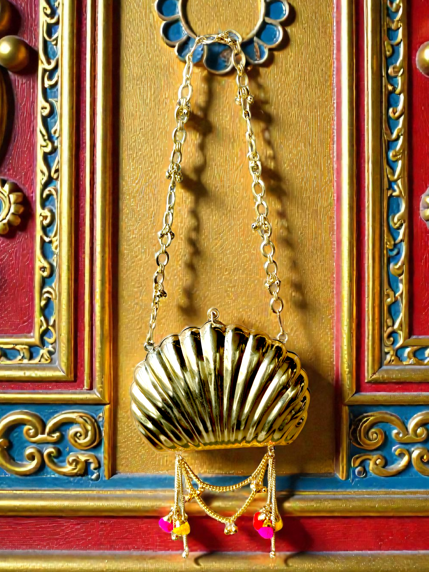 The Shell Heritage Brass Ghungroo bag in gold tone