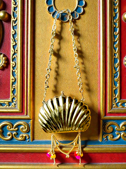 The Shell Heritage Brass Ghungroo bag in gold tone