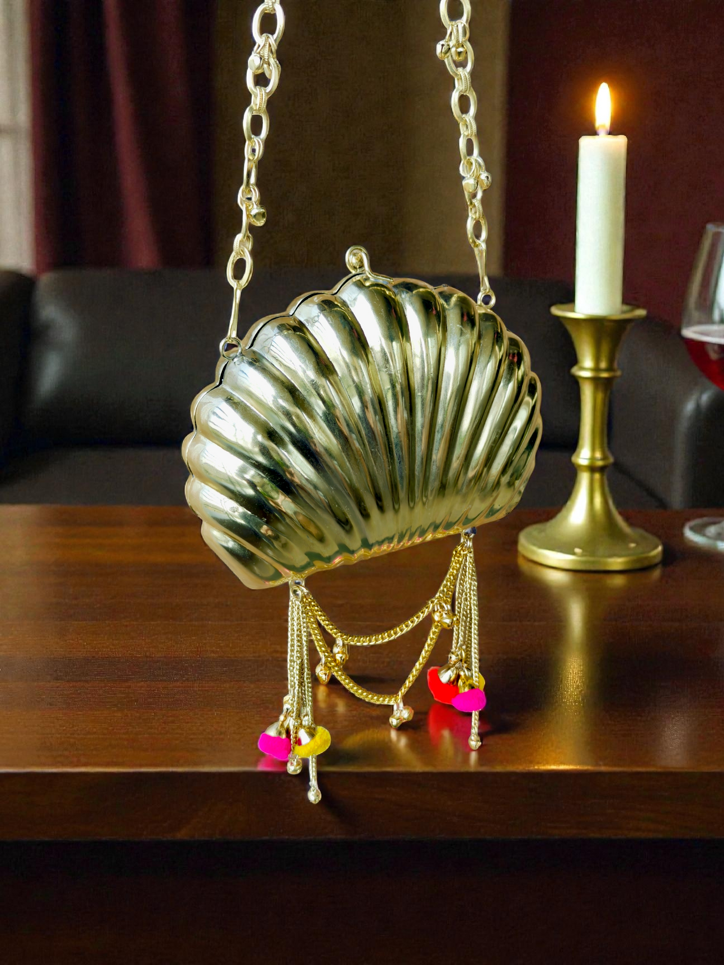 The Shell Heritage Brass Ghungroo bag in gold tone