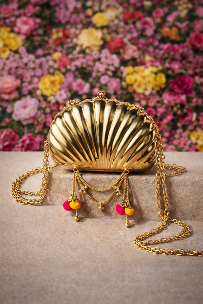 The Shell Heritage Brass Ghungroo bag in gold tone