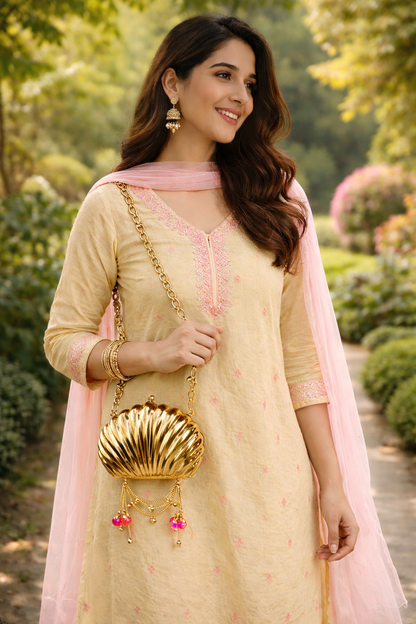 The Shell Heritage Brass Ghungroo bag in gold tone