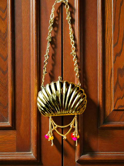 The Shell Heritage Brass Ghungroo bag in gold tone